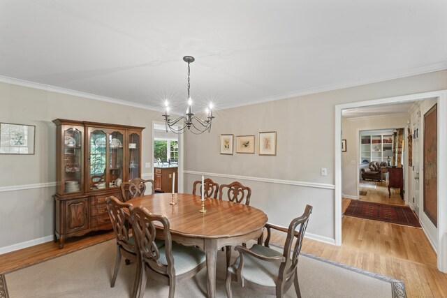 6 Middlebrook Pond Rd, Redding, CT 06896 - dining space with a chandelier, light wood-style floors, crown molding, and baseboards