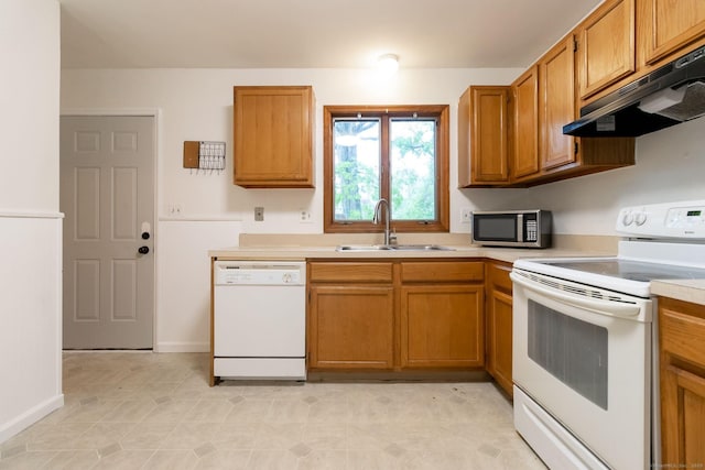 146 Macarthur Dr Unit 2B, Waterbury, CT 06704 - kitchen featuring white appliances, a sink, under cabinet range hood, and light countertops