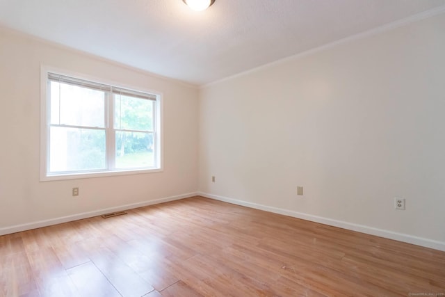 146 Macarthur Dr Unit 2B, Waterbury, CT 06704 - empty room with light wood-style flooring, ornamental molding, and baseboards