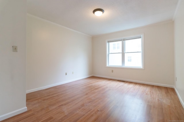 146 Macarthur Dr Unit 2B, Waterbury, CT 06704 - empty room featuring crown molding, light wood-style floors, and baseboards
