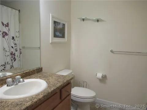 986 E St S, Suffield, CT 06078 - bathroom featuring toilet, vanity, and a shower with shower curtain