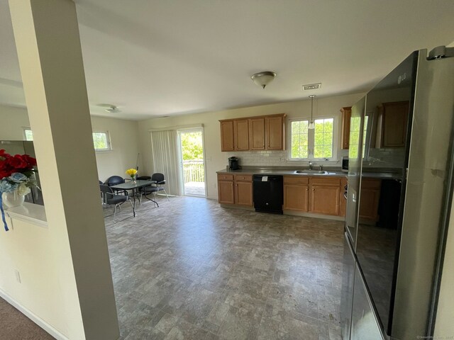 986 E St S, Suffield, CT 06078 - kitchen with dishwasher, freestanding refrigerator, a sink, and plenty of natural light
