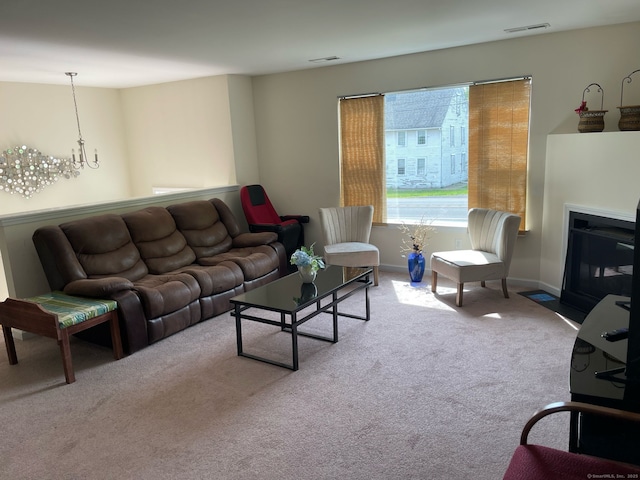 986 E St S, Suffield, CT 06078 - carpeted living area featuring a chandelier