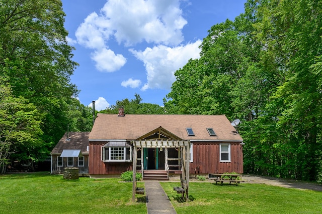 138 Baltic Hanover Rd, Sprague, CT 06330 - view of front of property with a front yard, a chimney, and board and batten siding