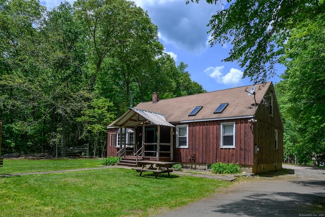 138 Baltic Hanover Rd, Sprague, CT 06330 - chalet / cabin with a front lawn, a chimney, and board and batten siding