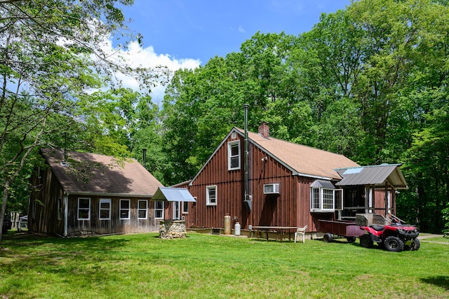 138 Baltic Hanover Rd, Sprague, CT 06330 - rear view of property featuring a lawn and a chimney