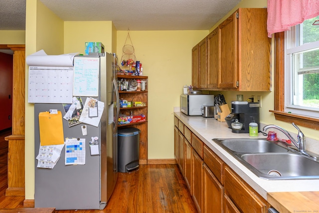 138 Baltic Hanover Rd, Sprague, CT 06330 - kitchen with a sink, stainless steel appliances, dark wood-style floors, light countertops, and a textured ceiling