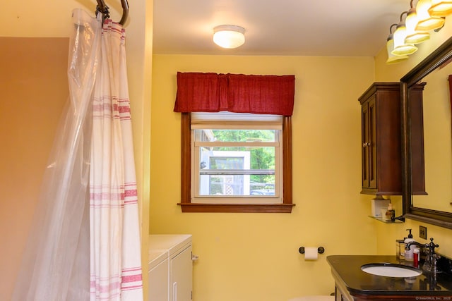 138 Baltic Hanover Rd, Sprague, CT 06330 - bathroom with vanity, toilet, and washing machine and dryer