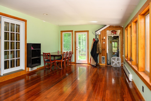138 Baltic Hanover Rd, Sprague, CT 06330 - dining room featuring wood-type flooring, a baseboard heating unit, and plenty of natural light