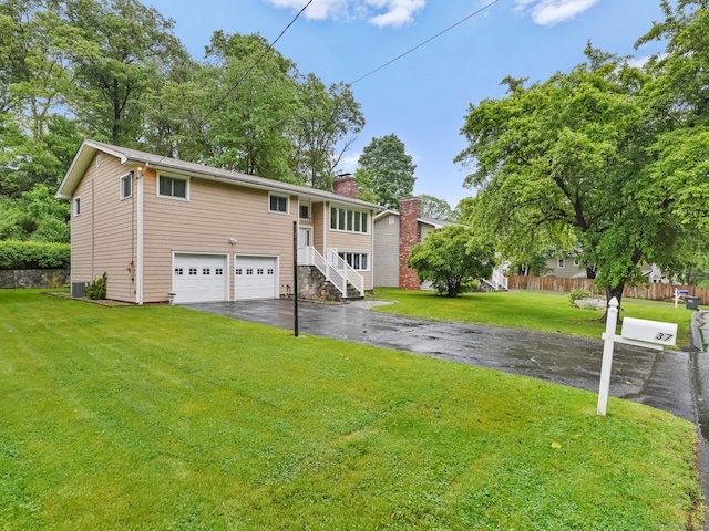 37 Windsor Ln, Greenwich, CT 06807 - bi-level home featuring driveway, an attached garage, a chimney, and a front yard