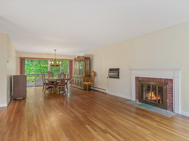 37 Windsor Ln, Greenwich, CT 06807 - dining area with light wood-type flooring, a chandelier, baseboard heating, and baseboards