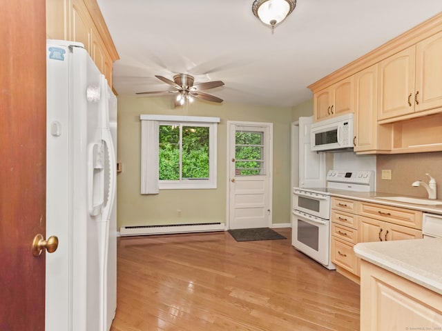 37 Windsor Ln, Greenwich, CT 06807 - kitchen with white appliances, light brown cabinets, a baseboard radiator, a sink, and light countertops