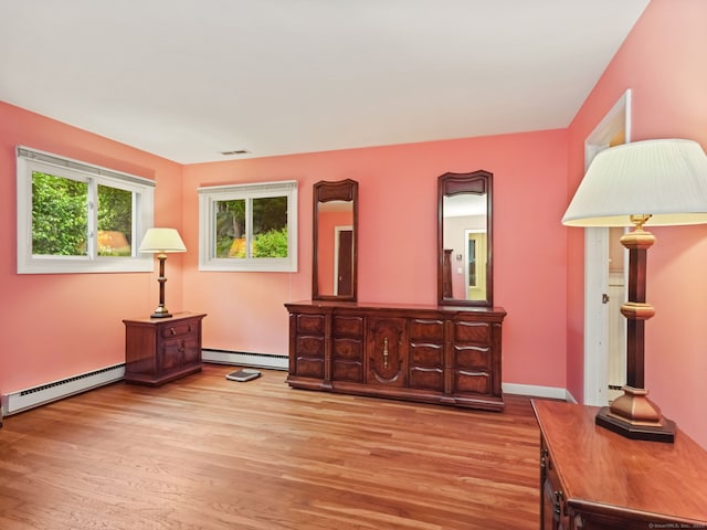 37 Windsor Ln, Greenwich, CT 06807 - bedroom with a baseboard heating unit, baseboard heating, and light wood finished floors