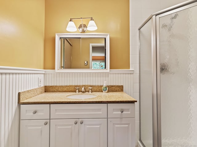 37 Windsor Ln, Greenwich, CT 06807 - bathroom featuring a shower stall, a wainscoted wall, and vanity