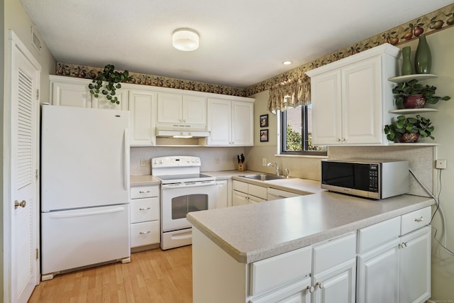 78 Heritage Vlg Unit A, Southbury, CT 06488 - kitchen with white appliances, under cabinet range hood, open shelves, a sink, and white cabinets