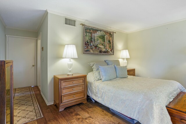 78 Heritage Vlg Unit A, Southbury, CT 06488 - bedroom featuring ornamental molding and dark wood-style flooring