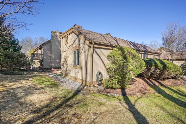 78 Heritage Vlg Unit A, Southbury, CT 06488 - view of home's exterior with a yard and a chimney