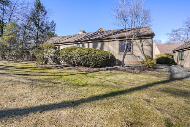 78 Heritage Vlg Unit A, Southbury, CT 06488 - view of side of home featuring a lawn and a chimney