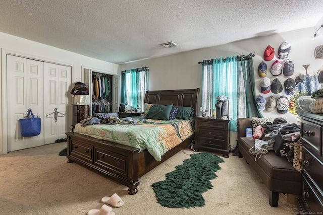 108 Ashmead Commons Unit 108, Enfield, CT 06082 - bedroom with multiple windows, carpet floors, a textured ceiling, and multiple closets