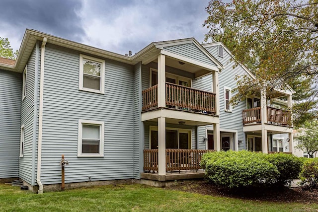 108 Ashmead Commons Unit 108, Enfield, CT 06082 - back of property featuring a balcony and a yard