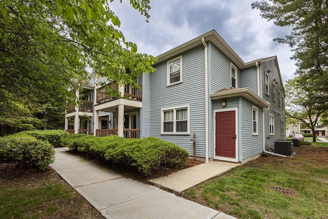 108 Ashmead Commons Unit 108, Enfield, CT 06082 - view of property exterior with central AC and a balcony