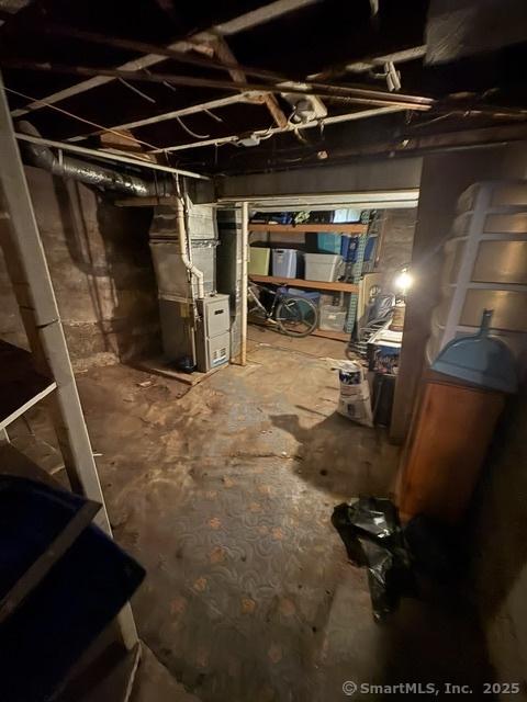 50 N St, Manchester, CT 06042 - unfinished basement featuring heating unit