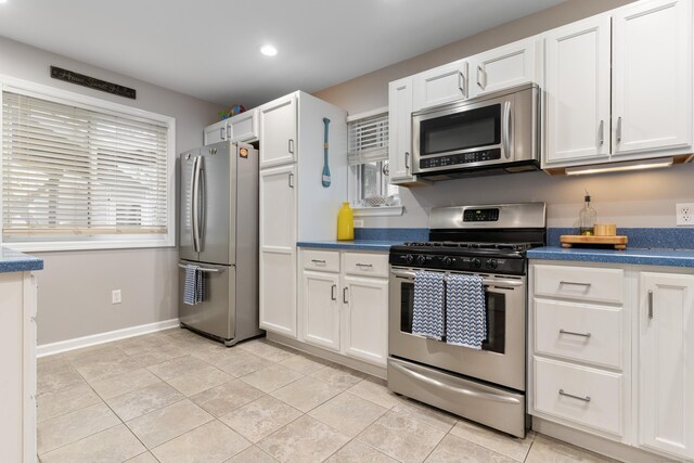 1 Mansfield Grove Rd Apt 205, East Haven, CT 06512 - kitchen featuring appliances with stainless steel finishes, white cabinets, recessed lighting, dark countertops, and baseboards