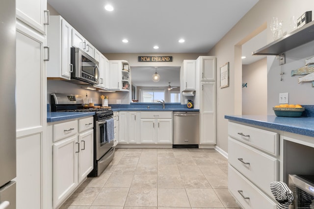 1 Mansfield Grove Rd Apt 205, East Haven, CT 06512 - kitchen featuring stainless steel appliances, white cabinets, open shelves, dark countertops, and recessed lighting