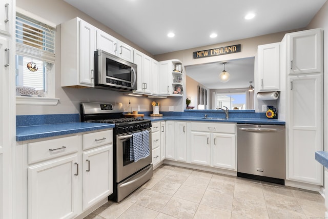 1 Mansfield Grove Rd Apt 205, East Haven, CT 06512 - kitchen with stainless steel appliances, dark countertops, a sink, white cabinets, and recessed lighting