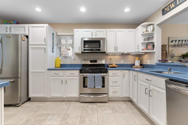 1 Mansfield Grove Rd Apt 205, East Haven, CT 06512 - kitchen featuring stainless steel appliances, a sink, white cabinets, and recessed lighting