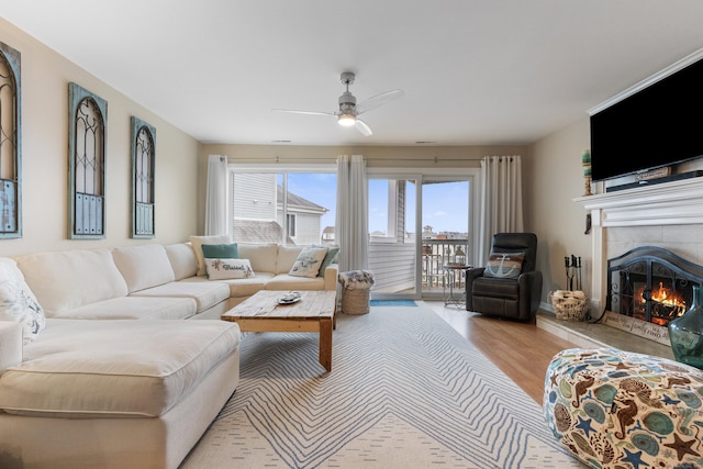 1 Mansfield Grove Rd Apt 205, East Haven, CT 06512 - living area with wood finished floors, ceiling fan, and a tile fireplace