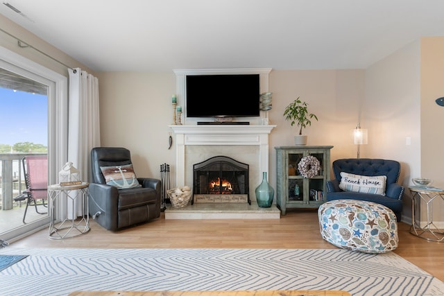 1 Mansfield Grove Rd Apt 205, East Haven, CT 06512 - living room featuring wood finished floors and a tiled fireplace