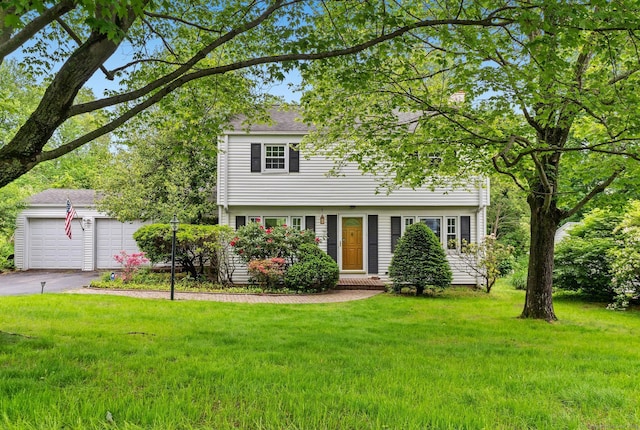 10 Richmond Rd, West Hartford, CT 06117 - colonial inspired home with a front lawn, a garage, and driveway