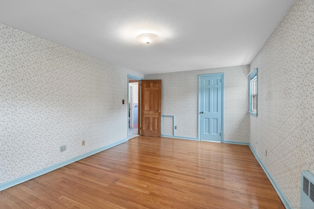 10 Richmond Rd, West Hartford, CT 06117 - spare room featuring light wood-style flooring, wallpapered walls, and baseboards