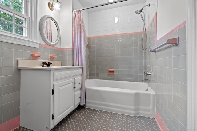 10 Richmond Rd, West Hartford, CT 06117 - full bathroom with tile walls, shower / tub combo with curtain, vanity, and a wainscoted wall