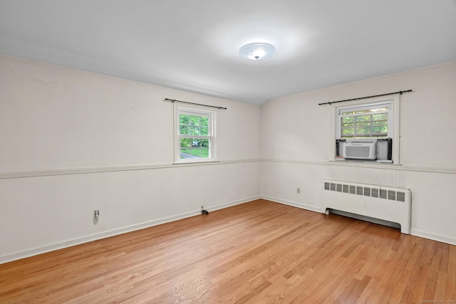 10 Richmond Rd, West Hartford, CT 06117 - unfurnished room featuring radiator, wood finished floors, plenty of natural light, and baseboards