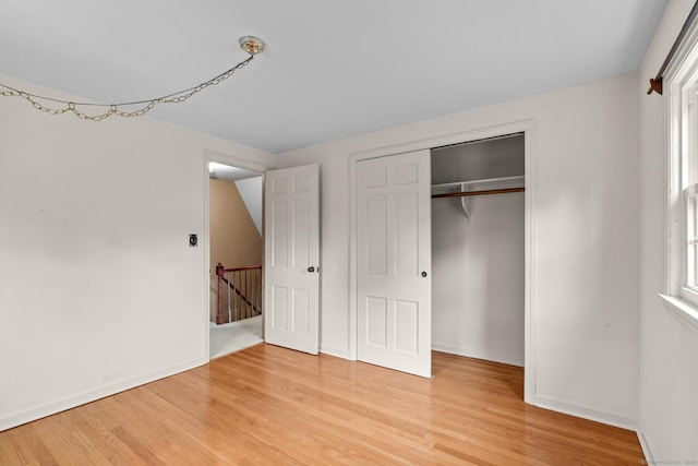10 Richmond Rd, West Hartford, CT 06117 - unfurnished bedroom with light wood-style flooring, baseboards, and a closet