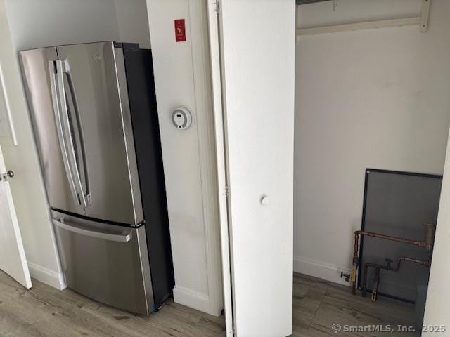 61 Clinton Ave Apt 6, Stamford, CT 06901 - kitchen featuring freestanding refrigerator, wood finished floors, and baseboards