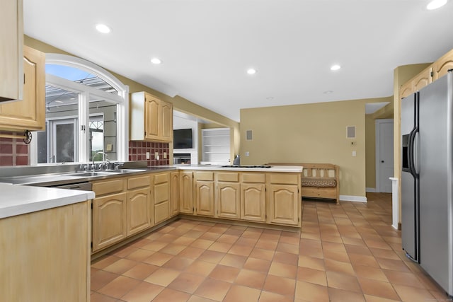 440 Hilltop Rd, Bridgeport, CT 06605 - kitchen with stainless steel fridge with ice dispenser, light brown cabinets, a sink, light tile patterned flooring, and recessed lighting