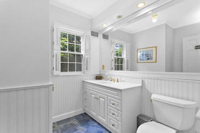 440 Hilltop Rd, Bridgeport, CT 06605 - half bath featuring vanity, toilet, wainscoting, ornamental molding, and healthy amount of natural light