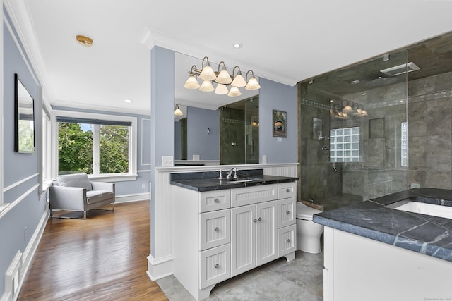 440 Hilltop Rd, Bridgeport, CT 06605 - full bathroom with crown molding, vanity, tiled shower, wood finished floors, and baseboards