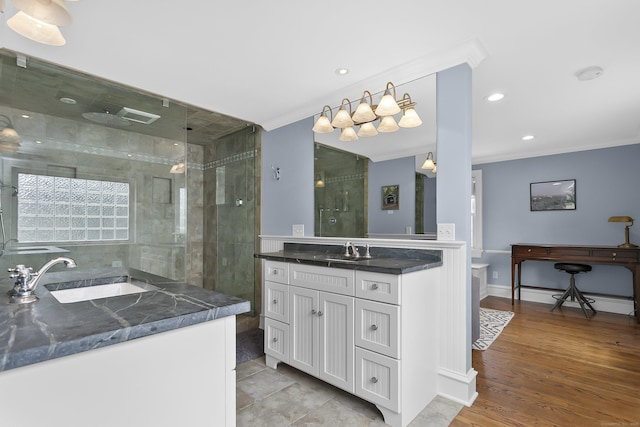 440 Hilltop Rd, Bridgeport, CT 06605 - bathroom featuring two vanities, ornamental molding, a shower stall, recessed lighting, and baseboards
