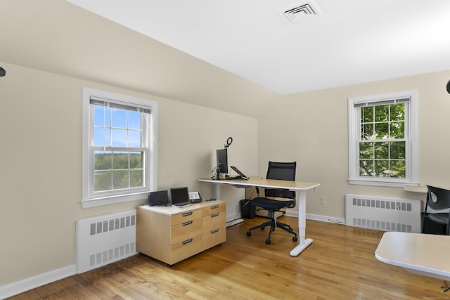 440 Hilltop Rd, Bridgeport, CT 06605 - office space featuring radiator heating unit, light wood-style flooring, baseboards, and vaulted ceiling