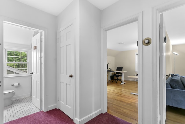 440 Hilltop Rd, Bridgeport, CT 06605 - corridor featuring a desk and baseboards