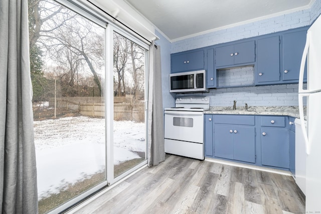12 Wistar Ct, Darien, CT 06820 - kitchen with white appliances, crown molding, blue cabinetry, light wood-style floors, and a sink