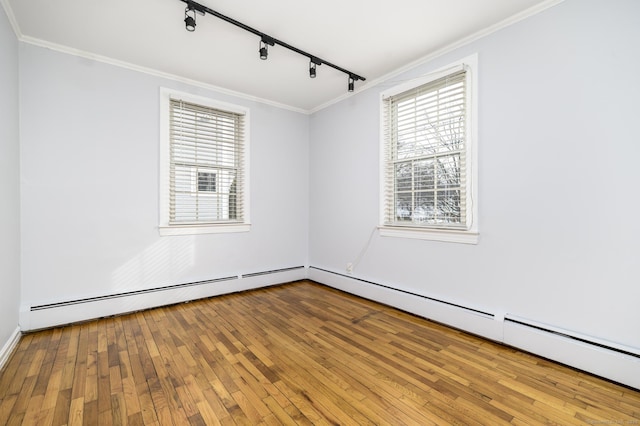 12 Wistar Ct, Darien, CT 06820 - spare room featuring rail lighting, crown molding, hardwood / wood-style floors, and a baseboard radiator