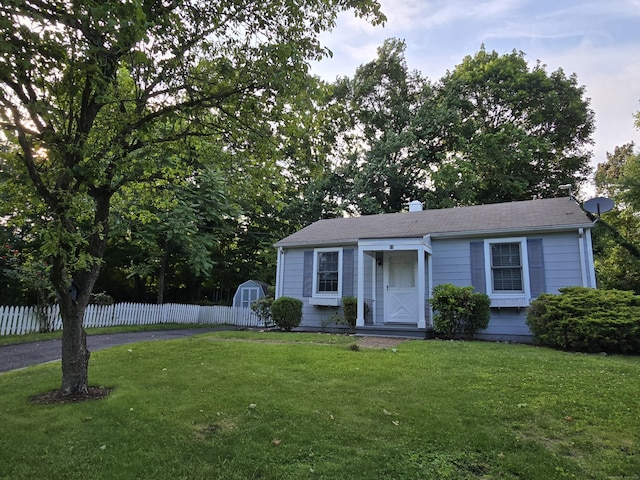 12 Wistar Ct, Darien, CT 06820 - view of front of home featuring a chimney, a storage shed, and roof with shingles