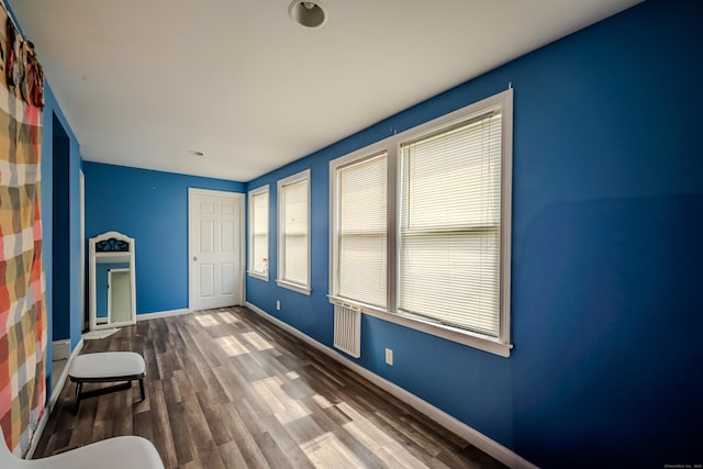 88 Boston Post Rd, Milford, CT 06460 - unfurnished sunroom featuring plenty of natural light and radiator