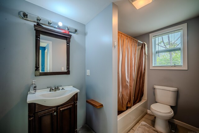 88 Boston Post Rd, Milford, CT 06460 - bathroom featuring vanity, toilet, shower / bath combination with curtain, tile patterned flooring, and baseboards