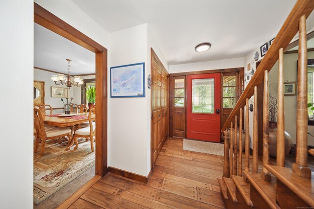 11 College Hill Rd, North Canaan, CT 06018 - entryway featuring light wood finished floors, stairs, and a chandelier